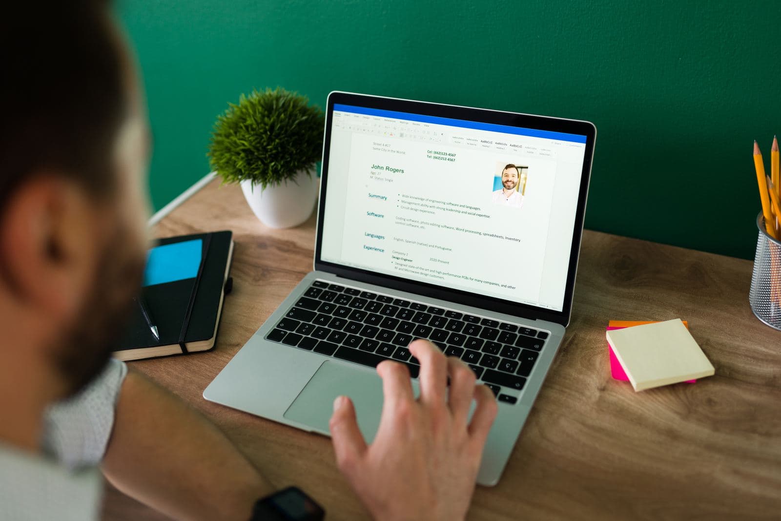 Job seeker polishing their CV on a laptop